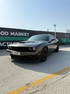 Rent a 2022 Dodge Challenger in Al Muraqqabat photo 9
