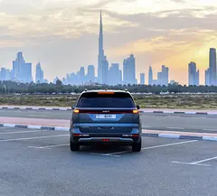Rent a 2024 Kia Carnival in Al Garhoud photo 3