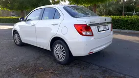 Rent a 2024 Suzuki Dzire in Al Karama photo 2