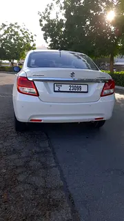 Rent a 2024 Suzuki Dzire in Al Karama photo 4