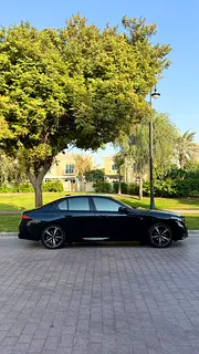 Rent a 2024 BMW 5-Series in Dubai Sports City photo 4