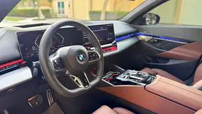 Rent a 2024 BMW 5-Series in Dubai Sports City photo 6
