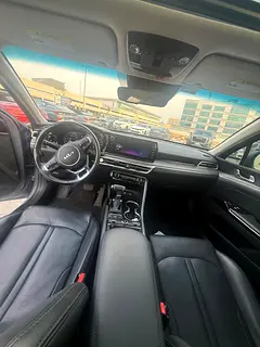 Rent a 2023 Kia K5 in Airport Road Area photo 4