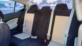 Rent a 2024 Nissan Sunny in Emirates Golf Club Residences photo 8